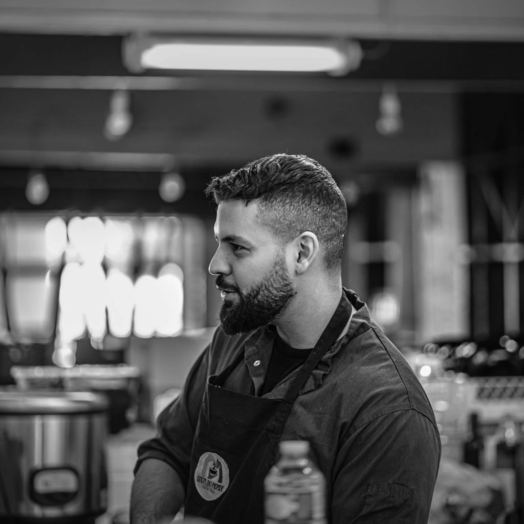 Portrait of Chef Daniel Okafor in the Chicago prep kitchen.